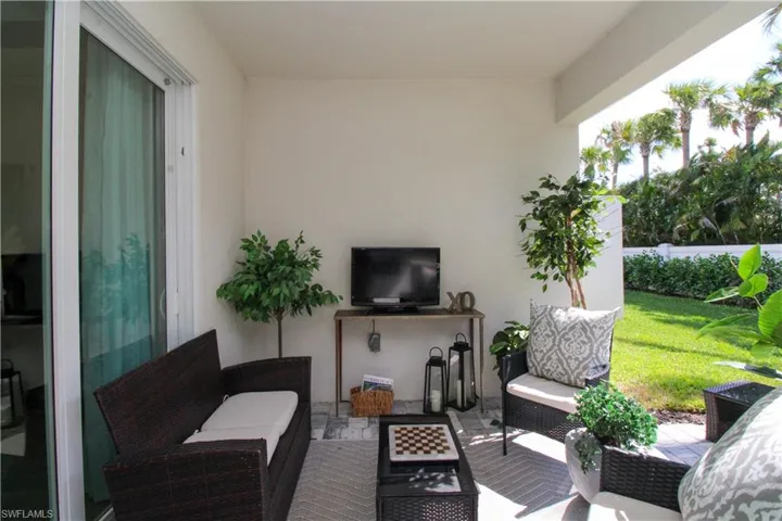 View of patio with an outdoor hangout area