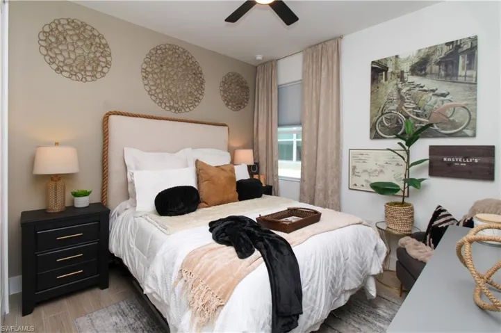 Bedroom featuring wood finished floors and a ceiling fan