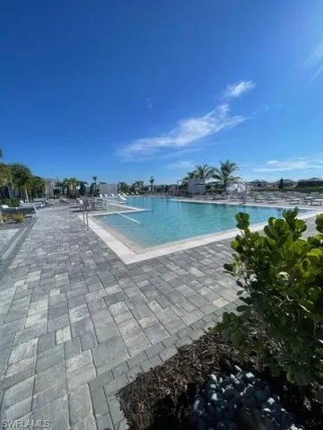 Community pool featuring a patio area