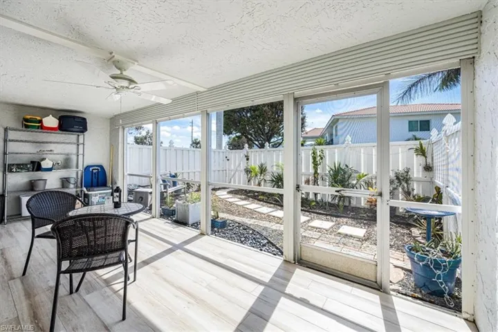 The patio overlooks the private, fenced professionally landscaped yard