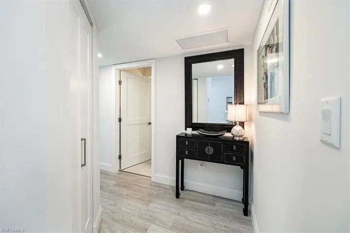 Hallway going to both bedrooms and bathrooms