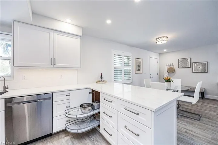 Kitchen featuring smart corner cabinetry storage solution and ample drawer storage