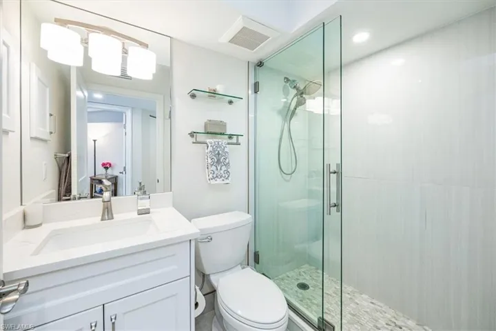 Guest Bathroom with walk in shower with frameless shower door
