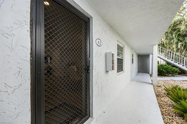 Front door and covered entry to the property