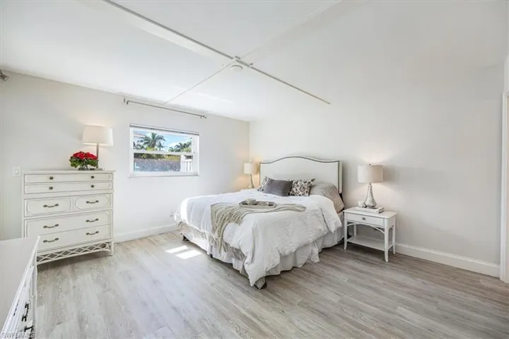 Large primary bedroom with black out window treatments