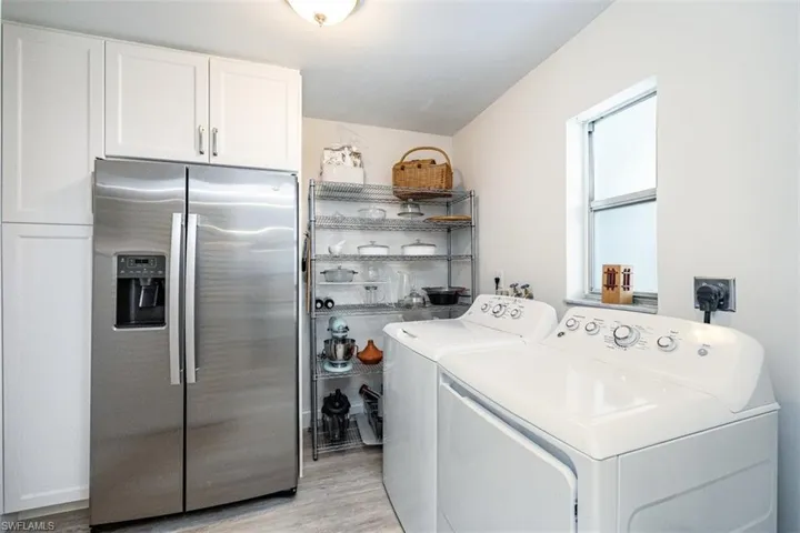 The kitchen was redesigned to maximize counter space, with the refrigerator now tucked back w/ the laundry and pantry area.