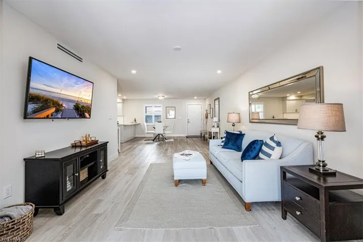 Living room facing the foyer and kitchen