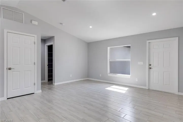 Unfurnished living room featuring light wood-type flooring and recessed lighting
