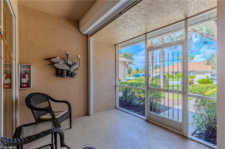 View of unfurnished sunroom and entrance