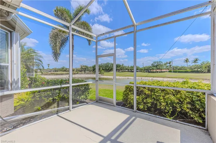 Unfurnished sunroom with a water view