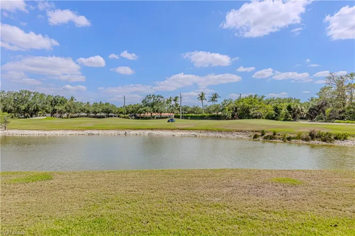 Water view with a tree filled landscape