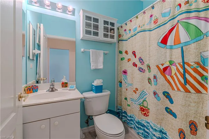 Guest Bath room-Full bath with vanity and a shower with curtain