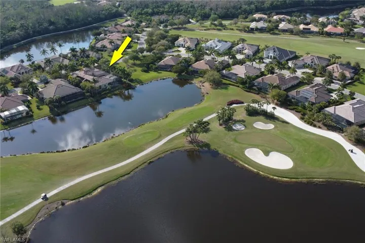 Drone / aerial view featuring a water view, a residential view, and golf course view