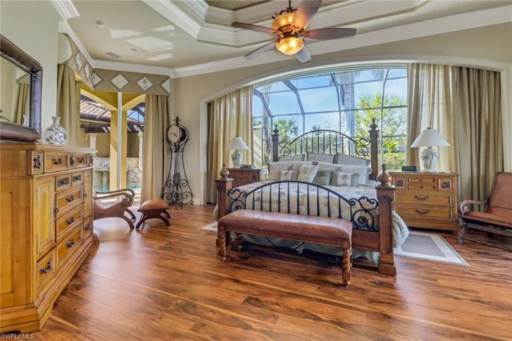 Spacious master bedroom with sliders to lanai and a private deck overlooking the golf course