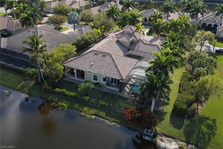 Drone / aerial view with a water view and a residential view