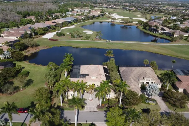 Bird's eye view featuring a water view, a residential view, and golf course view