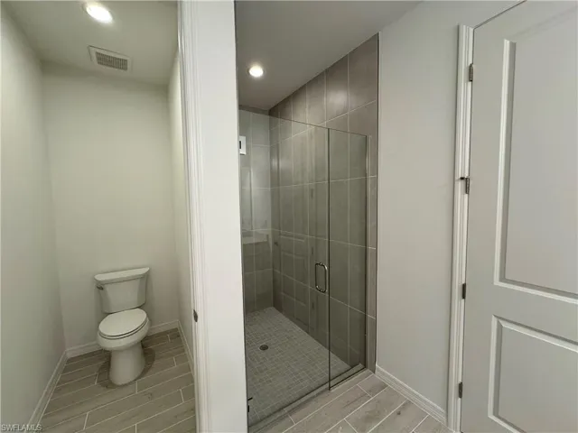 Primary bathroom with luxe, walk-in closet and private water closet