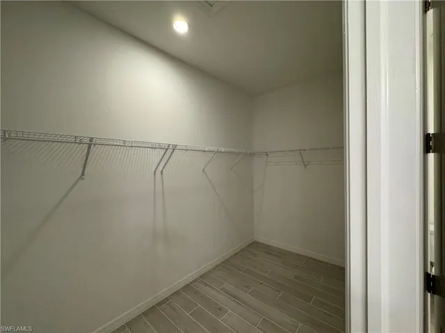 Spacious walk-in closet in primary bedroom
