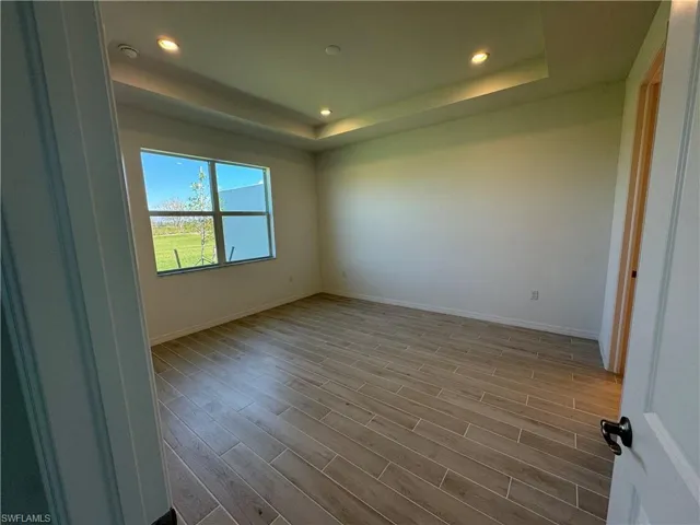 Primary bedroom suite with tray ceiling