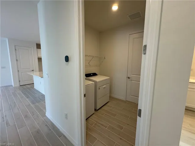 Laundry room with washer and gas dryer