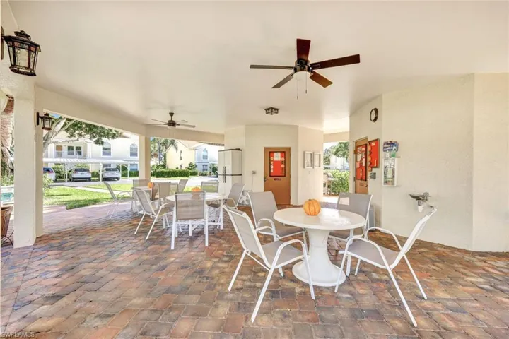 View of patio featuring outdoor dining space and ceiling fan