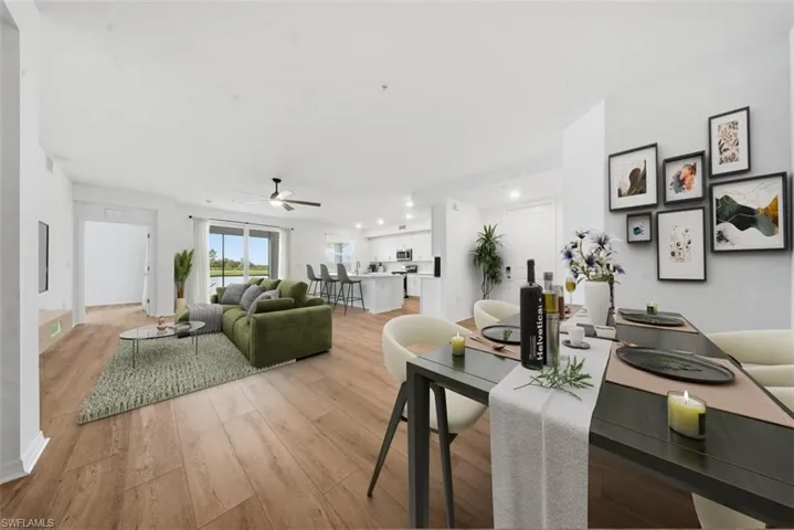 Dining space with light wood-style flooring, a ceiling fan, and recessed lighting