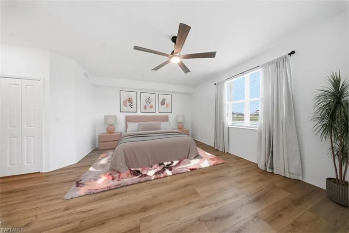 Bedroom featuring light wood-style floors and ceiling fan