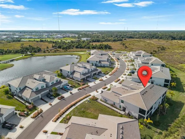 Aerial view of residential area with a large body of water