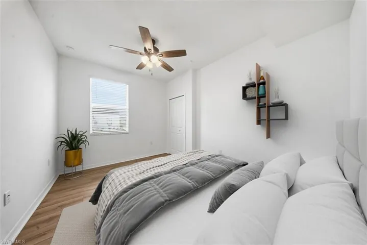 Bedroom with wood finished floors and a ceiling fan