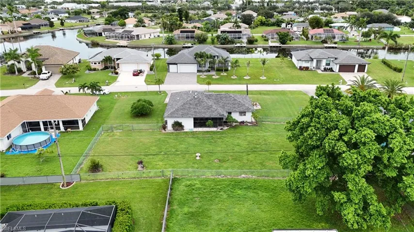 Aerial view of residential area with a large body of water