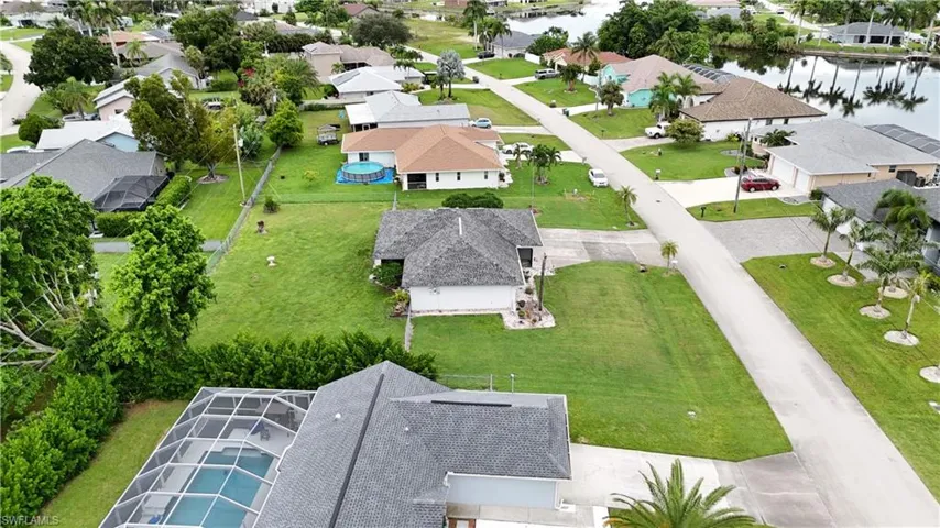Aerial view of residential area with a large body of water
