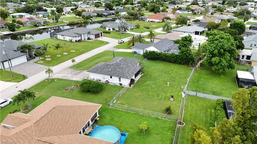 Aerial view of residential area with a nearby body of water