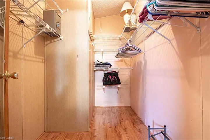 Spacious closet featuring wood finished floors