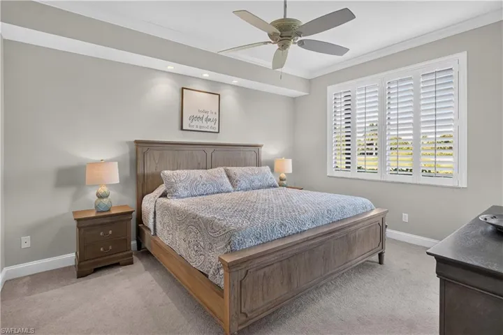 Carpeted room featuring a ceiling fan, recessed lighting, and crown molding