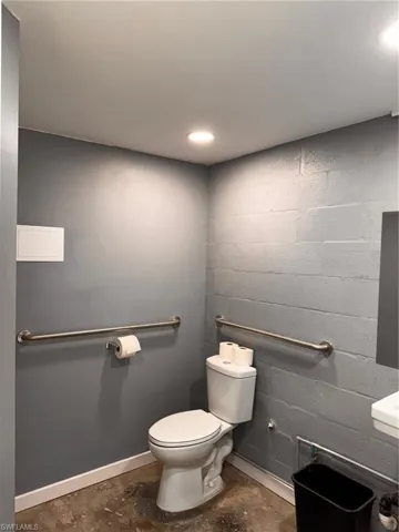 Bathroom with concrete floors and toilet