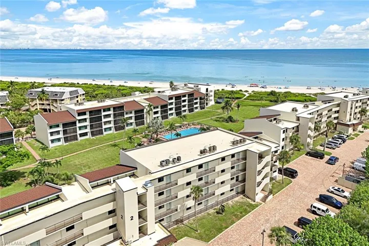 Bird's eye view featuring a water view and a view of the beach