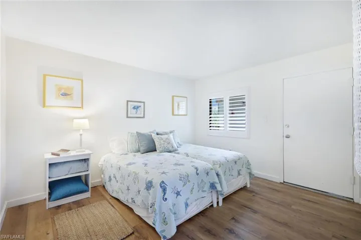 Bedroom featuring wood-type flooring