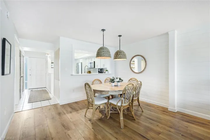 Dining area with sink and light hardwood / wood-style floors