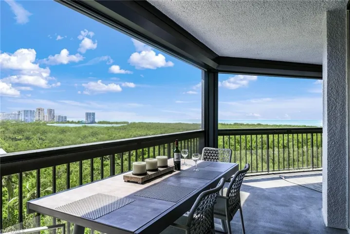 One of the most expansive screened-in lanai's in Pelican Bay, almost 70' long!!  All rooms open out on the lanai except the den.