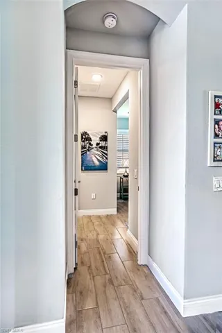 Corridor with light hardwood / wood-style floors