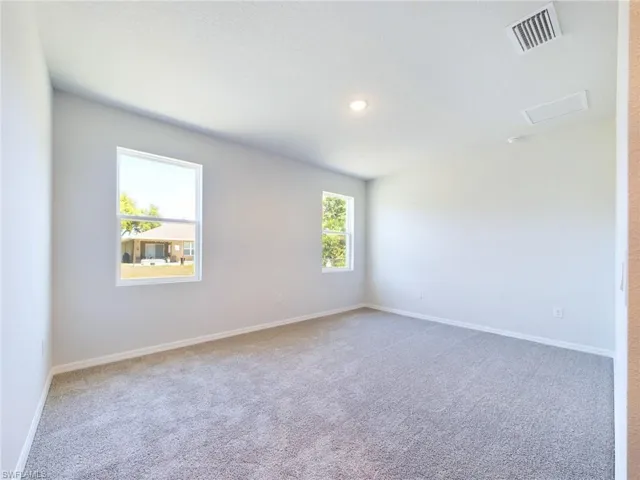 Spare room with carpet floors