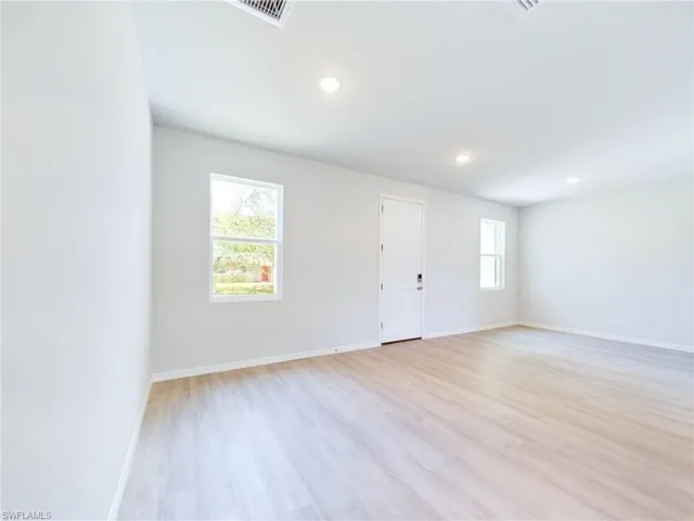 Unfurnished room with light wood-type flooring