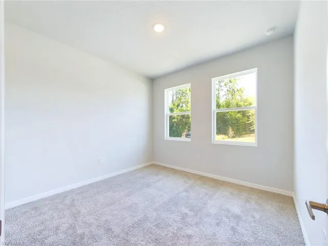 View of carpeted spare room