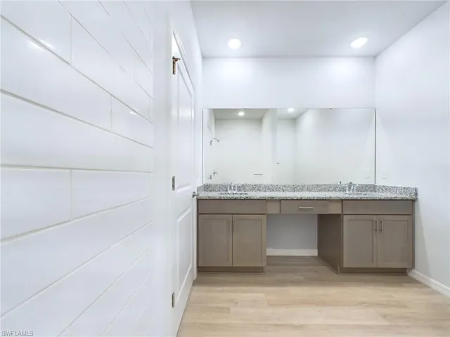 Bathroom featuring wood-type flooring and vanity