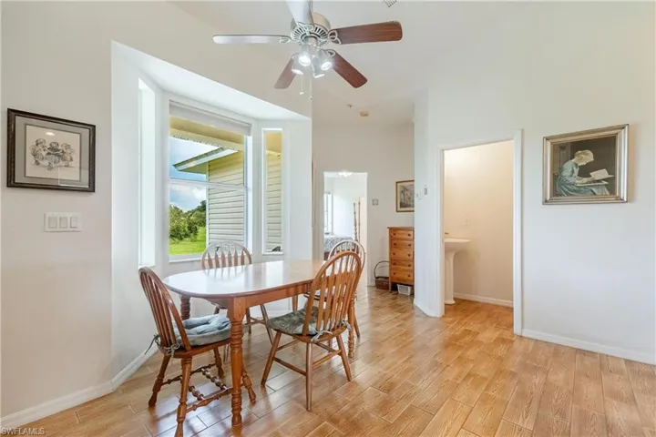 Dining room featuring light wood-type flooring and ceiling fan