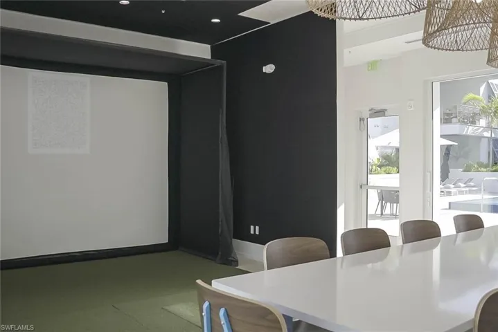 Golf simulator in community room with bathrooms, and sauna - all on the 2nd level -just steps from the patio of unit #208