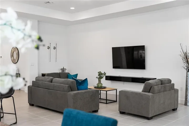 Living room featuring tile patterned floors