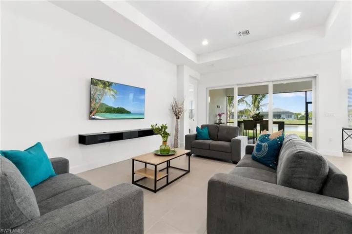 Tiled living room with a tray ceiling