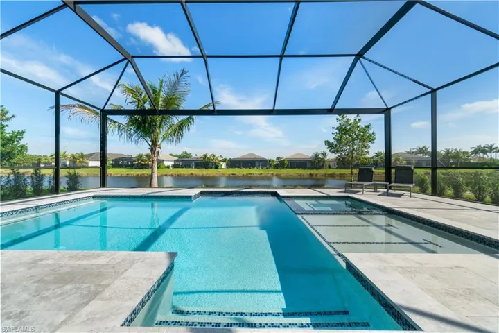 View of pool featuring a patio and a lanai