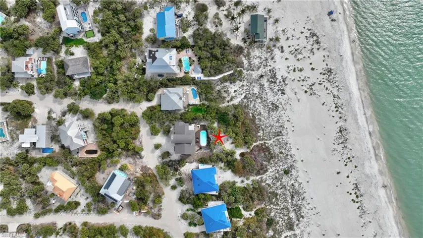 Entryway with light wood finished floors, french doors, baseboards, and stairway